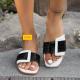 Wearing square shaped stone patterned oversized slippers outside