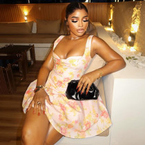 Backless printed A-line dress with camisole and waist cinching for a shorter look