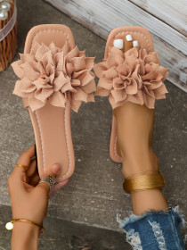 Wearing flat sandals over oversized slippers