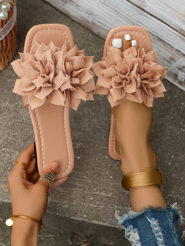 Wearing flat sandals over oversized slippers