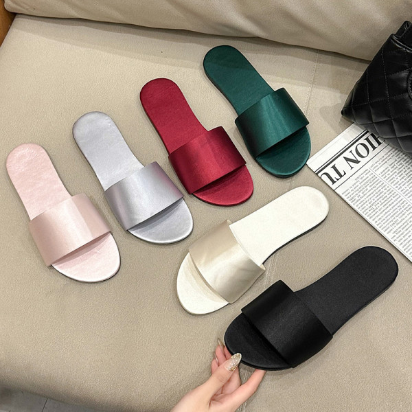 Home slippers made of silk and satin with a flat bottom