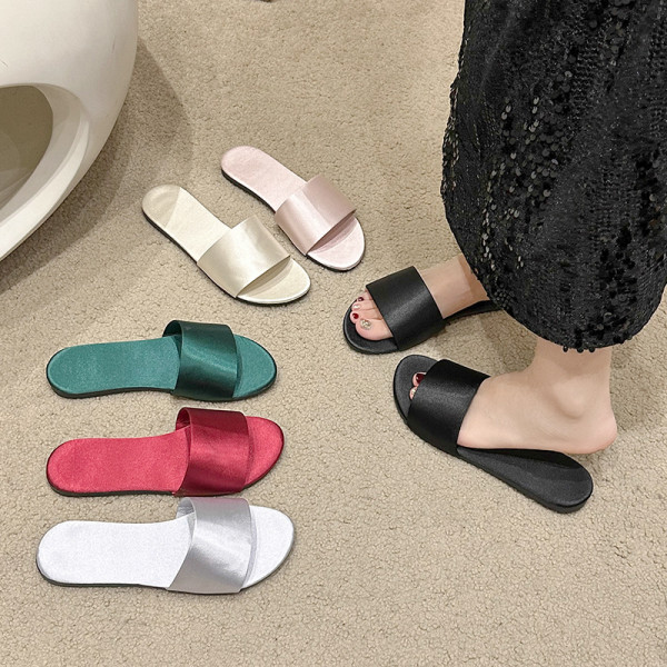 Home slippers made of silk and satin with a flat bottom