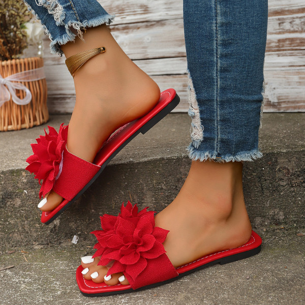 Wearing flat sandals over oversized slippers