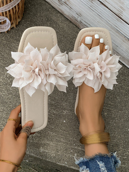 Wearing flat sandals over oversized slippers