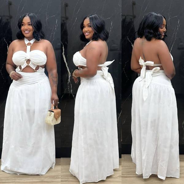 Two piece set of padded strapless top with suspender and neck hanging long skirt