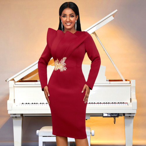 Embroidered long sleeved evening gown, mid length skirt