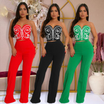 Two piece set of strapless short top paired with solid colored pants