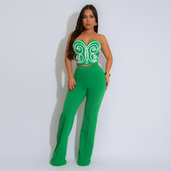 Two piece set of strapless short top paired with solid colored pants