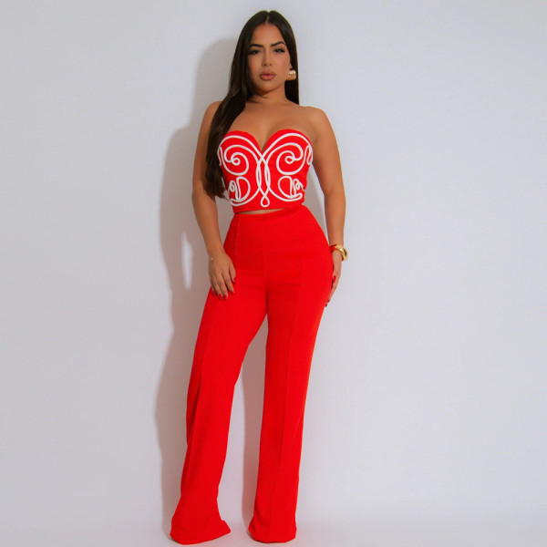 Two piece set of strapless short top paired with solid colored pants