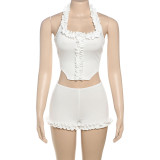 Two piece set of ruffled edge hanging neck vest and bottom shorts