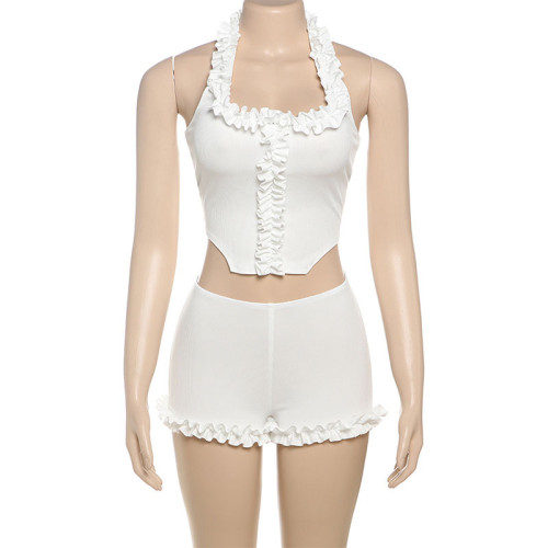 Two piece set of ruffled edge hanging neck vest and bottom shorts