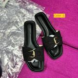 Flat bottomed women's flip flops with buckle on the outside