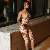 Printed circular neck strap with large open back seven part jumpsuit
