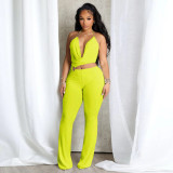 Circle decoration hanging neck and exposed waist jumpsuit