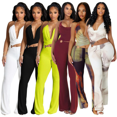 Circle decoration hanging neck and exposed waist jumpsuit