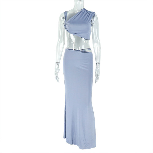 Two piece set with exposed navel, strapless sloping collar top, hip hugging long skirt