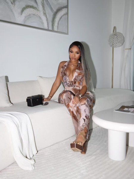 Printed neck hanging, backless waist cinched sleeveless jumpsuit
