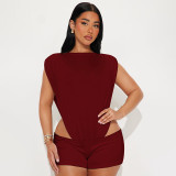 Inverted triangular pleated waist revealing jumpsuit, bag and hip set