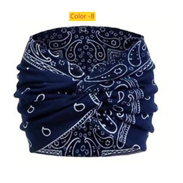 Printed headband, sports makeup, tied hair, crossed wide edge headband