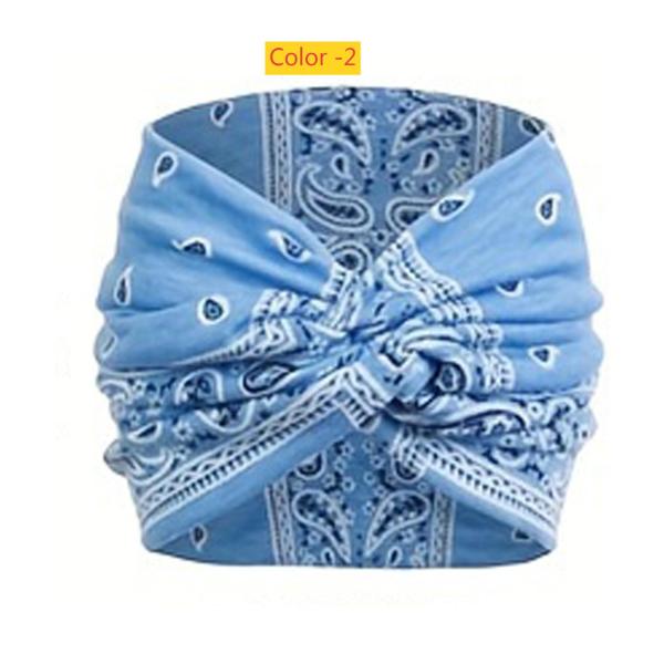 Printed headband, sports makeup, tied hair, crossed wide edge headband
