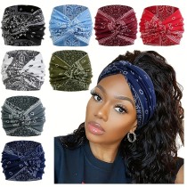 Printed headband, sports makeup, tied hair, crossed wide edge headband Printed headband, sports makeup, tied hair, crossed wide edge headband