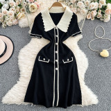 Color blocking short sleeved knitted single breasted medium length dress