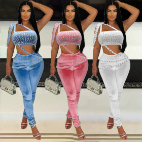 Two piece set of strapless and navel exposed short top paired with long pants