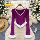 Contrast striped knit shirt with ruffled hem and flared sleeves as a base top