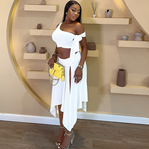 Two piece set of sleeveless single shoulder top with ribbon and half split skirt