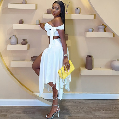 Two piece set of sleeveless single shoulder top with ribbon and half split skirt