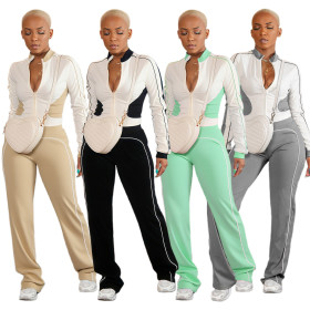 Two piece set of white spliced zipper top and pants