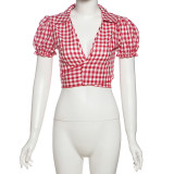 Deep V-notch plaid versatile top with exposed navel