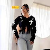 Cross hole tassel long sleeved loose fitting pullover knitted sweater