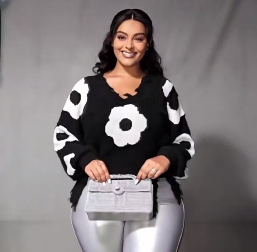 Cross hole tassel long sleeved loose fitting pullover knitted sweater