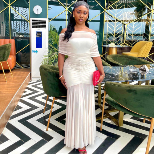 Shoulderless pleated hip hugging skirt with a one neck strapless and slightly transparent dress