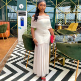 Shoulderless pleated hip hugging skirt with a one neck strapless and slightly transparent dress