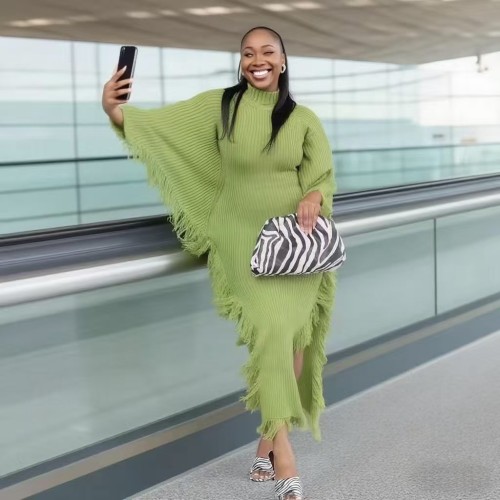 Knitted tassel dress with high neck, bat sleeves, and split hips