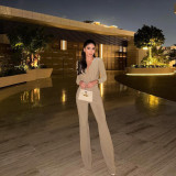 Deep V-long sleeved micro flared jumpsuit