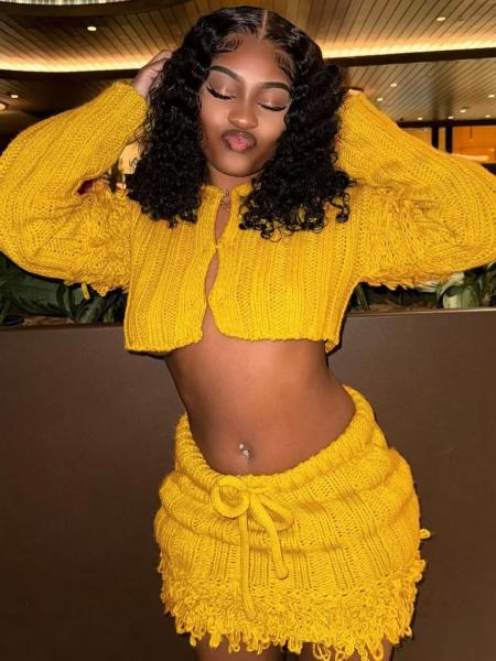 Open navel long sleeved cardigan with tassel skirt two-piece set