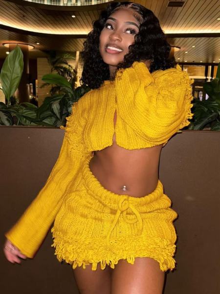 Open navel long sleeved cardigan with tassel skirt two-piece set