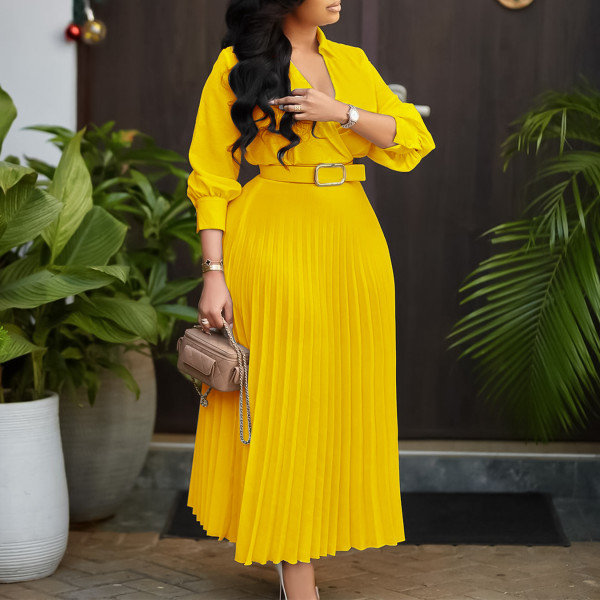 V-neck solid color long sleeved pleated dress with large skirt hem