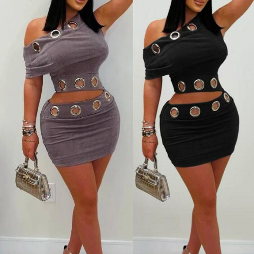 Two-piece set consisting of a golden velvet sloping shoulder top and a hip-hugging short skirt