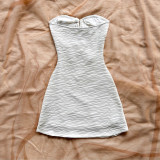 Hollow-out metal decorative camisole and hip-hugging skirt