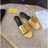 Flat bottomed oversized sandals worn on top of one word slippers