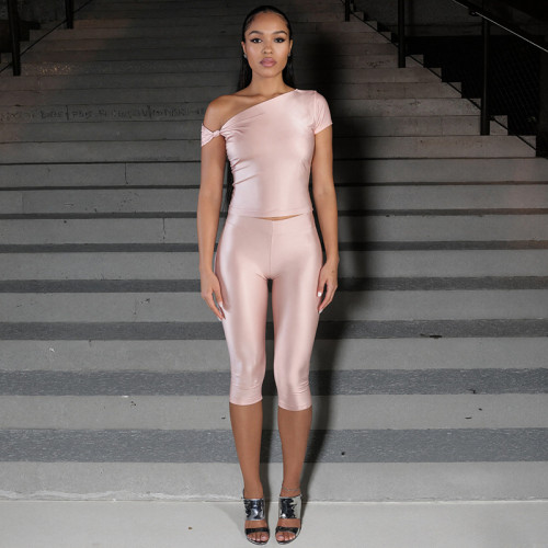 Diagonal cross twisted off shoulder pullover top with high waist and hip hugging cropped pants set