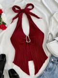 Tie up metal buckle, asymmetrical hem vest with a snug fit