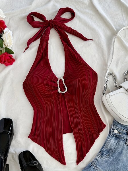 Tie up metal buckle, asymmetrical hem vest with a snug fit