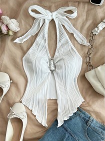 Tie up metal buckle, asymmetrical hem vest with a snug fit