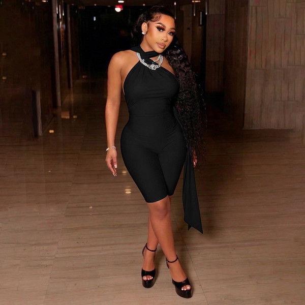 Twisted neck hanging ribbon V-shaped pleated waist revealing circular splicing jumpsuit