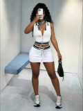 Sleeveless top with exposed navel and lace up short skirt set